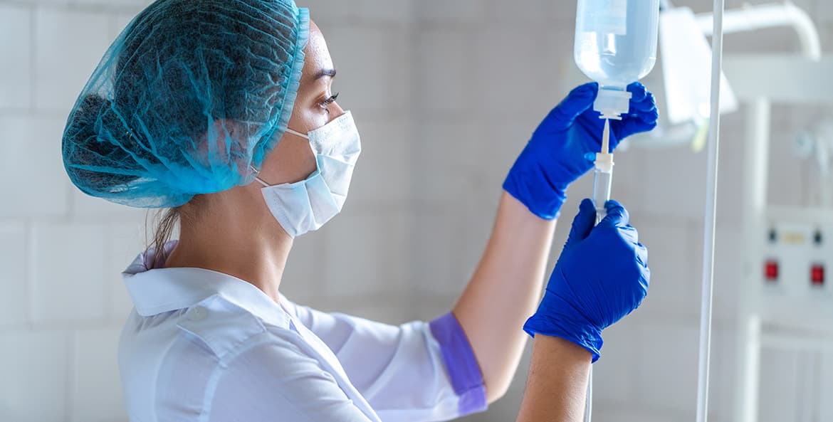 Technician preparing an IV line